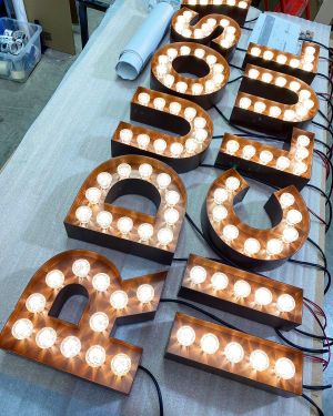 Click Here To Enlarge This Photo Of Retail Lighting and Bespoke Signs